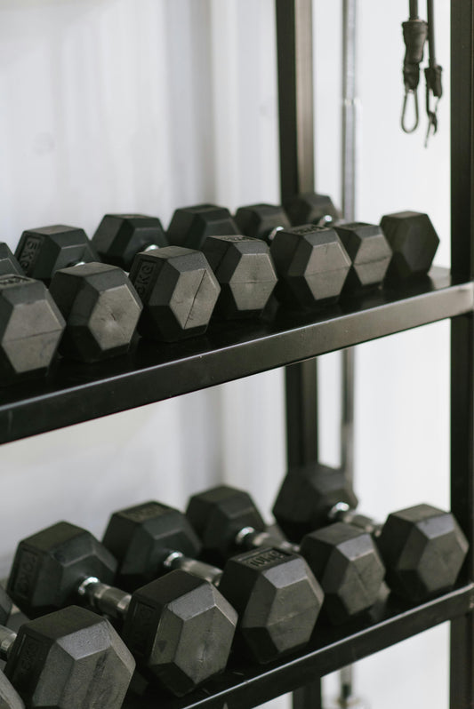 Weight rack filled with dumbbells of various weights