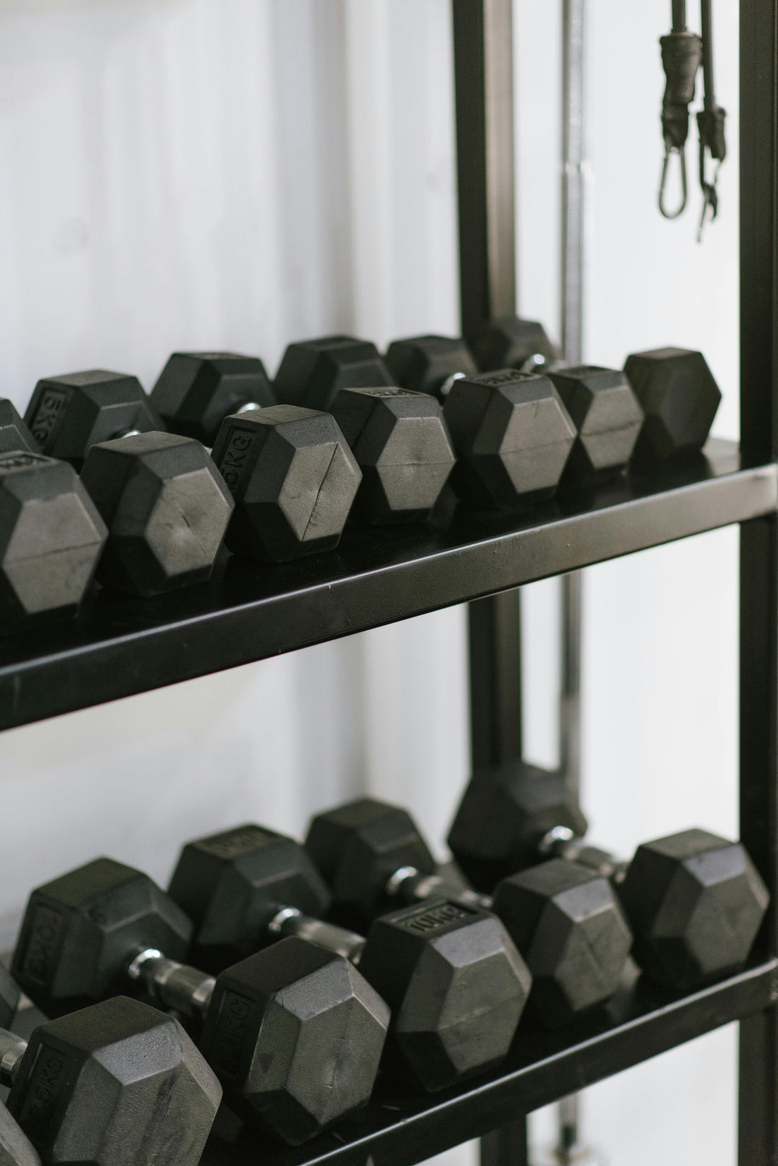 Weight rack filled with dumbbells of various weights